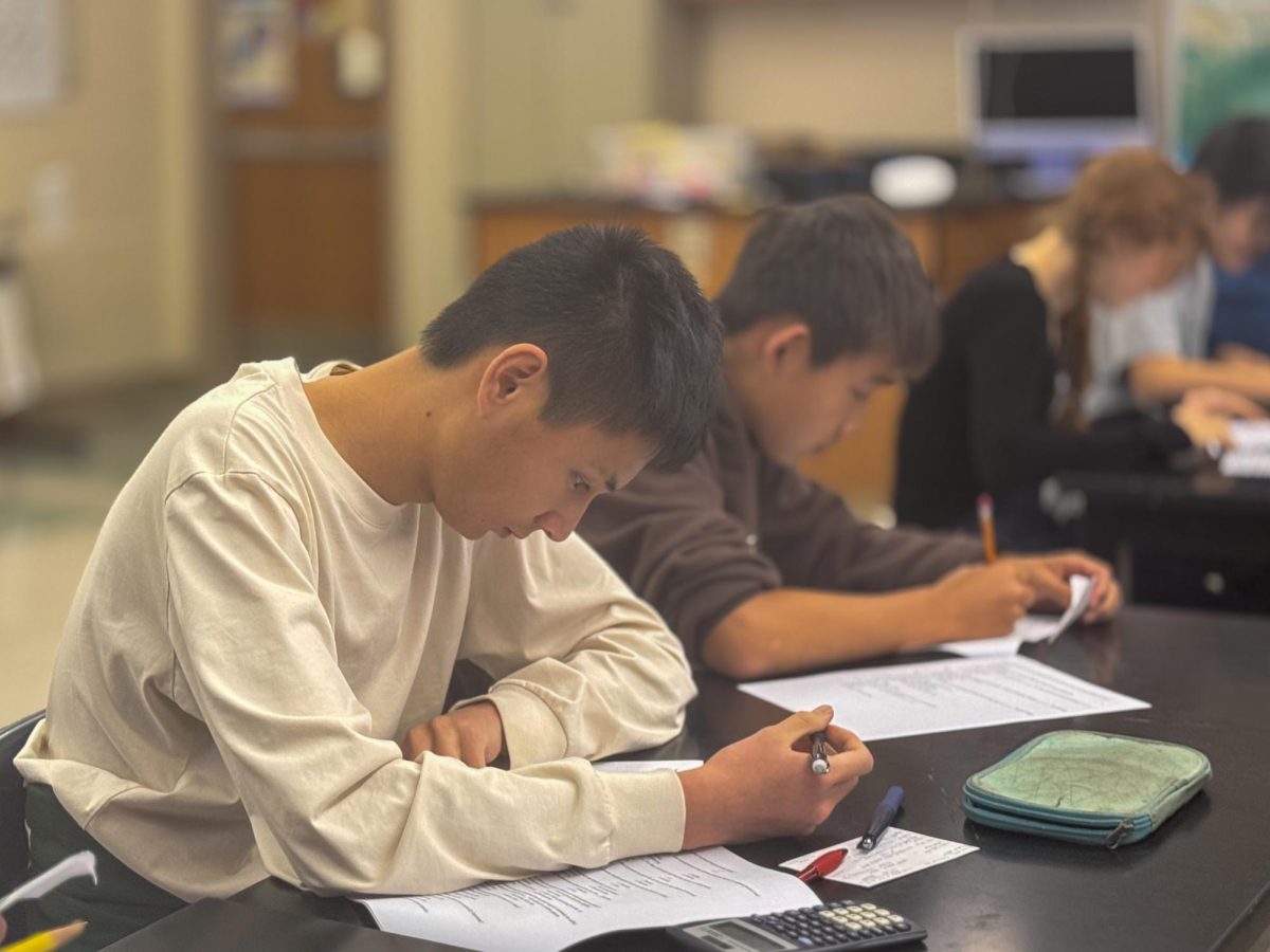 Palo Alto High School senior Forrest Chou takes the Science Olympiad tryout test on Sept. 24 in Room 1702. According to Chou, Science Olympiad introduced him to upperclassmen who served as his role models. "I first tried out for SciOly in ninth grade, and immediately, I regretted not doing it in sixth grade," Chou said. "It was really cool to interact with seniors who are like me but three years ago. It was really amazing to see all those people who are so dedicated to their respective passions, like computer science and even stuff like diving."