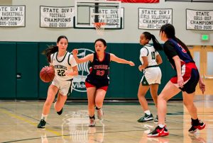 Viking freshman Sophia Hill rushes past Lynbrook defender, leading to a mid range hook shot in the first quarter of the game. According to Vikings head coach Kevin Blunt, the team did a good job applying offensive pressure. "What we did well was being aggressive and going to the basket, which got some of them in foul trouble," Blunt said. 