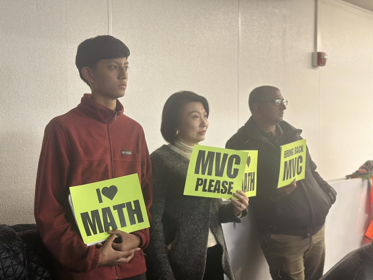 Freshman Oscar Varodayan and other Multivariable Calculus advocates hold signs at the Palo Alto Unified School District board meeting last week hoping to persuade board members to add multivariable calculus as a math elective next year. According to Varodayan, this year was the first time he truly enjoyed a math class due to the challenge. “This year was the first year where I fully enjoyed my math class because it was a fully challenging class so thanks to the district for providing me the mechanisms which allowed me to advance," Varodayan said.