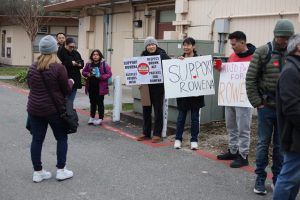 Community members wait to be let into Palo Alto Unified School District's board meeting tonight. According to JLS Principal Christopher Grierson, he hopes the meeting will be diplomatic. “I'm nervous about the board meeting,” Grierson said. “I want everyone to be respectful and I hope that our school board, district leaders and community members can continue to be respectful of everyone that we serve.”