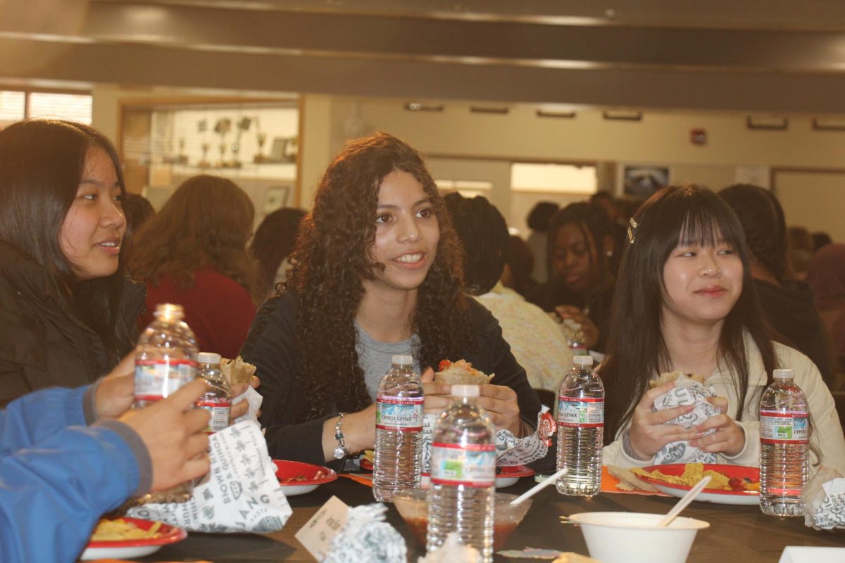 Students from Townley Grammar School in Bexleyheath eat lunch and engage in conversation Wednesday with the Principal's Advisory Committee members at Palo Alto High School. The visitors came to see how schools operate in an environment surrounded by technology. According to Townley Grammar School junior Ayo Thompson, schools in the U.K. are dissimilar to those in the U.S. “The difference is very interesting, and I'm getting a wider perspective on how education is in different parts of the world,” Thompson said.