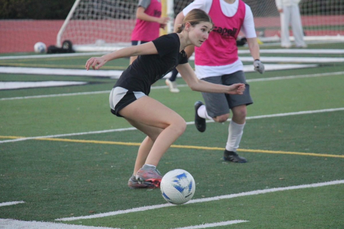 Sophomore Ellie Knott maneuvers the ball in the last practice before the first round of the Central Coast Section playoffs, where the Vikings are facing the Soledad High School Aztecs 5 p.m. today at home. According to senior Kaitlyn Lowry, the team has not done well in the first round of CCS in the past, but this year, they have been training extra hard and are hyped for the game. "We're all pretty excited," Lowry said. "We don't have a good track record, really, of making it past the first round. So, we've been training really hard. We haven't really had any off days yet, so we feel pretty prepared."