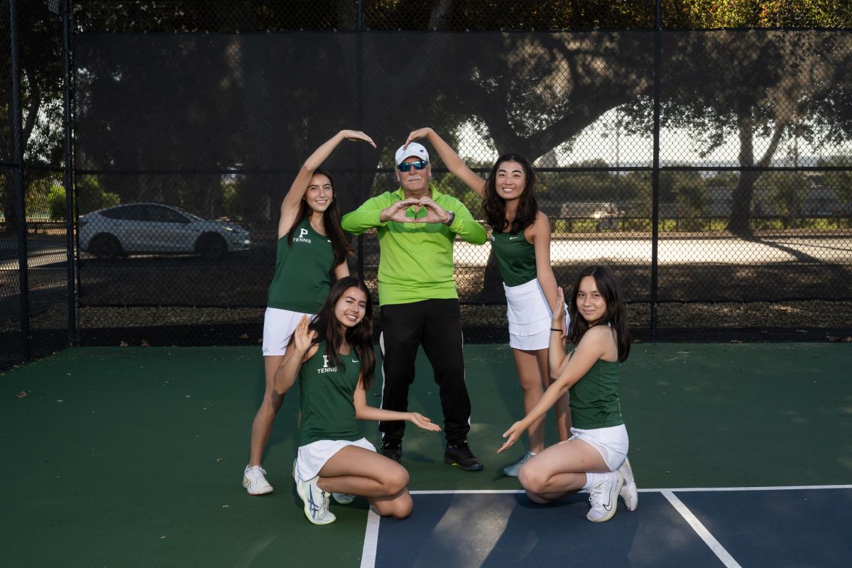 Seniors and girls varsity tennis players Mia Bowers, Audrey Horn, Erika Bussey and Jessica Bae stand alongside former Head Coach Andy Harader. According to Bae, Harader was a fun and supportive coach and many players will miss his coaching. “Sometimes Coach Andy Harader likes to lighten the mood by goofing around with us, and he’s game for any of our shenanigans,” Bae said. “Overall, he’s a very warm and caring coach who supports his players on and off the court. I’ll miss him and I’m sure all his players, past and previous, that he has influenced feel the same.”