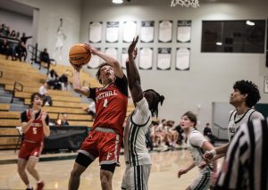 Cougar senior Cade Memeo jumps over Viking senior Jorell Clarks' block during a Division 3 CIF playoff game Tuesday night at Palo Alto High School. Viking head coach Jeff LaMere said CIF games are always a battle and unpredictable. “Anybody can beat anybody, and that's the exciting part of this tournament, and we're fortunate," LaMere said. 