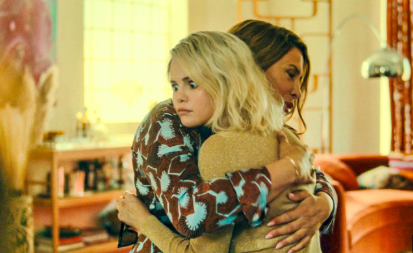 Former Mexican cartel leader Emilia Pérez (Karla Sofía Gascón), left, embraces her wife, Jessi del Monte (Selena Gomez), right, after reconnecting by posing as her own fictional cousin following her faked death and transitioning to a woman in the Spanish-language French musical crime film "Emilia Pérez," which has received 13 Academy Award nominations. 