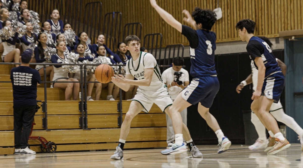 Viking senior Gavin Haase passes the ball weaving through the Scot defenders during the third quarter of the Central Coast Section playoff final. According to Haase, the crowd was good boost for the team. “The atmosphere was great,” Vikings senior Gavin Haase said. “A lot of Carlmont people, a lot of Paly people. It was really loud, and it felt like a rivalry.”