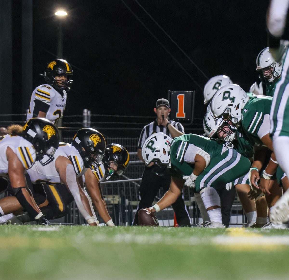 The Palo Alto Vikings line up against the Mountain View Spartans during a key first down on Friday night at home. Viking head coach David DeGeronimo said the Vikings need to work on their defense. “We [Palo Alto] are learning a new defense, and we've got to learn it in a hurry," DeGeronimo said. "The season’s started, so we've got to get guys experience in this and understanding the defense and their roles. Once we get those ironed out, I think we'll be pretty good.”