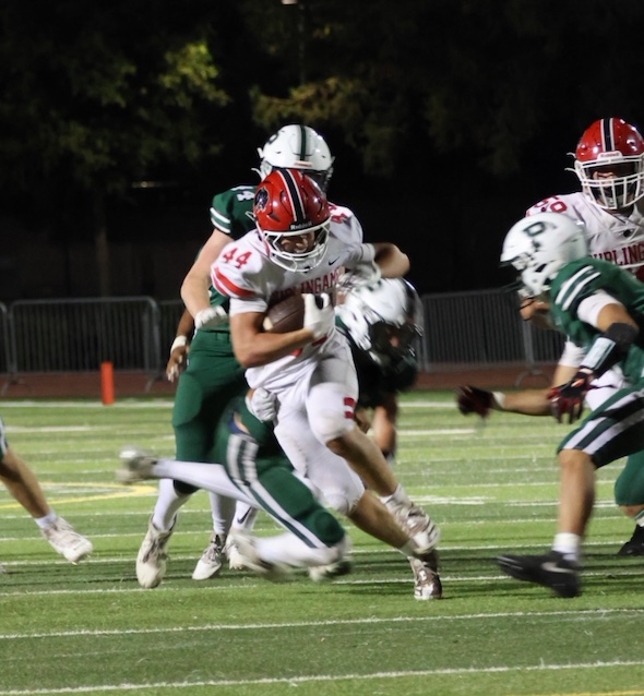 Panther running back Harrison Evars charges through the Viking defense last night at the Palo Alto High School Vikings Earl Hansen Stadium. According to Burlingame defensive coordinator Jason Selli, keeping the lead throughout the game was intentional. "We're really trying to focus on just not giving opponents second chances," Selli said.
