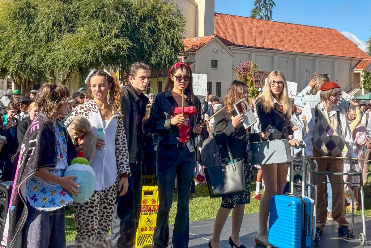 Palo Alto High School students gather Thursday brunch at the Quad for the fourth best-dressed competition, Generations Day. According to senior Amrita Munagala, her outfits for Spirit Week consisted of things she found around the house. “All of my Spirit Week stuff is from my home,” Munagala said. “I'm using my mom's nightgown, I brought my robe and I'm using my grandma's hair clip. I'm really bringing the grandma energy.”