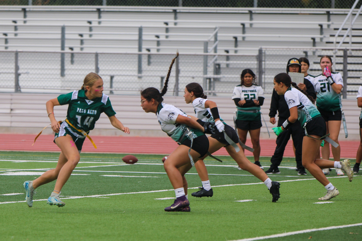 Sophomore defender Lucy Ybarbo rushes the Homestead quarterback, looking to disrupt the play during the Vikings’ 37-7 win at Wednesday's home game on Senior Night. The Vikings' defense stood out, shutting the Knights out in the second half and forcing many turnovers. According to Ybarbo, the team had a strong defense tonight against the Knights. “Our team did a pretty good job pulling flags today and playing defense,” Ybarbo said. 