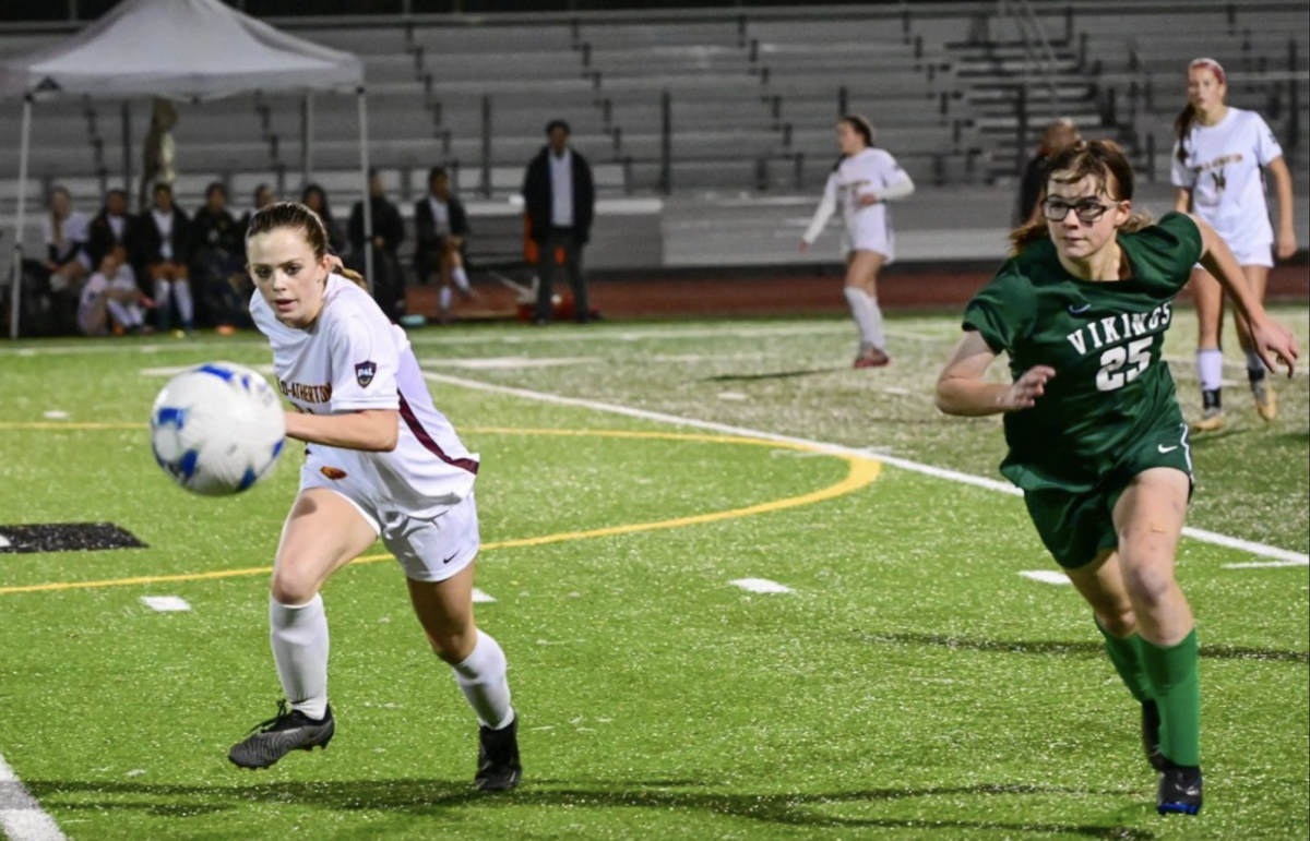 Viking junior Cassie Gracon chases down a ball against a Bear midfielder last season in a tie against the Menlo-Atherton Bears. According to Viking head coach Jeremy Romero, the Vikings are targeting a successful playoff run this season. “I believe our team will compete with the best,” Romero said. “We have nothing but exceptional players and I expect us to make a good run.”