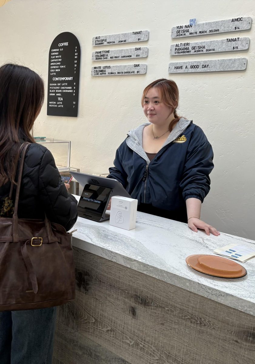 Barista Angel Lin tends to customers at the newest cafe in downtown Palo Alto, Goodthing Coffee. According to Lin, Goodthing's opening has been successful so far. "We welcome a lot of customers every day," Lin said. "I've noticed a couple of regulars a few times too."