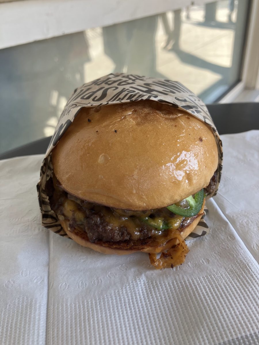 Jalapeno Smash ($13) Double angus beef patty, thinly sliced jalapeños, cheddar cheese, caramelized onions and sriracha aioli on a freshly baked bun.