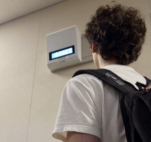 A student walks past the clock after the final bell of the school day. According to Palo Alto High School Librarian Sima Thomas, many Paly staff and faculty feel that the current schedule pushes school too late into the day. “There has been discontent starting at 9:00 and ending at 4:10,” Thomas said. “It’s just late for teachers who have families and also for students who have sports.”