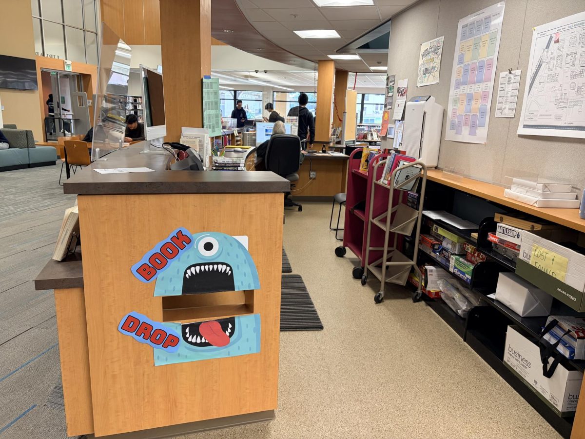 Students walk around in Palo Alto High School's library, but few approach the book dropbox. According to Librarian Sima Thomas, returning overdue books is an important responsibility that impacts the school's well-being. "Returning overdue books goes along with picking up your litter after lunch. They are both part of taking care of the school,” Thomas said. "While these resources are free to students, they are not free to the school.”