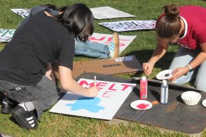 Students make protest signs at the Quad at Palo Alto High School during Thursday’s lunch in preparation for a Friday walkout to protest against Immigration and Customs Enforcement actions. According to participant and sign-maker Maya Cheng, the walkout is a great opportunity for students to speak up. “It's really cool to see how a bunch of people are coming together to really use their voice,” Cheng said.