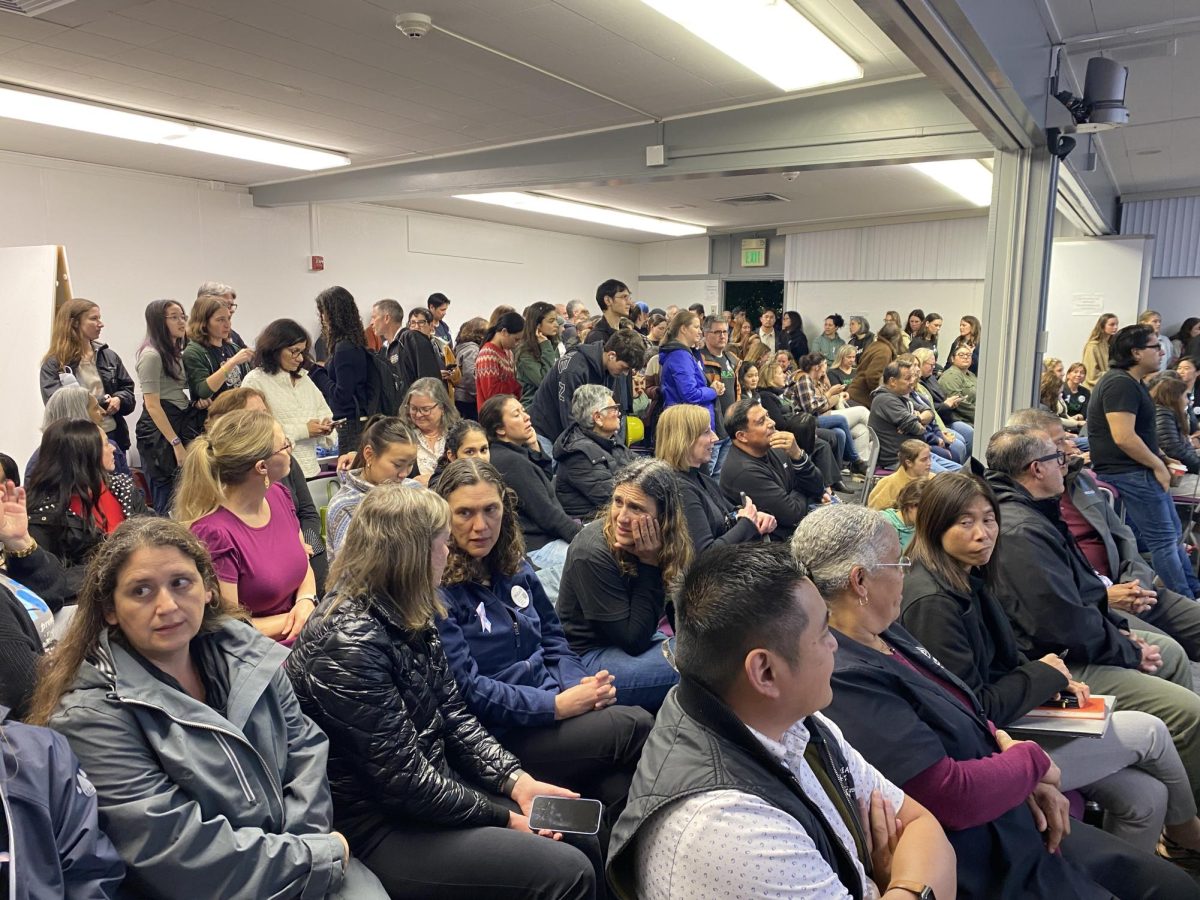 Board meeting attendees, many of whom are Palo Alto Educators Association members, filled the room at the district board meeting on Tuesday. According to math teacher Herb Bocksnick, the time teachers save by not having to produce their own copies lets them support students. “I have done 34 summer recommendations over the last two months afforded by the time that Veronica [Rodriguez] provided me instead of standing in front of a copier,” Bocksnick said.