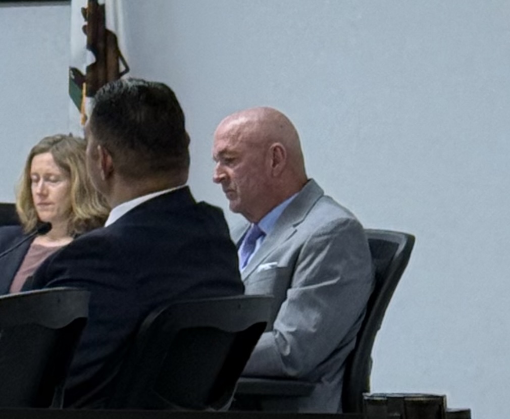 Superintendent Don Austin observes conversations during a January Palo Alto Unified District School Board meeting. The Board this morning announced its intention to separate themselves from the superintendent 'effective immediately but will wait to replace until June.