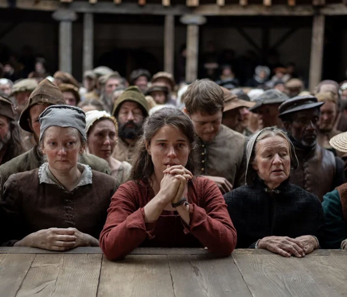 Agnes (Jessie Buckley) in one of the final scenes of "Hamnet" observing her husband's play, Hamlet, growing in popularity.