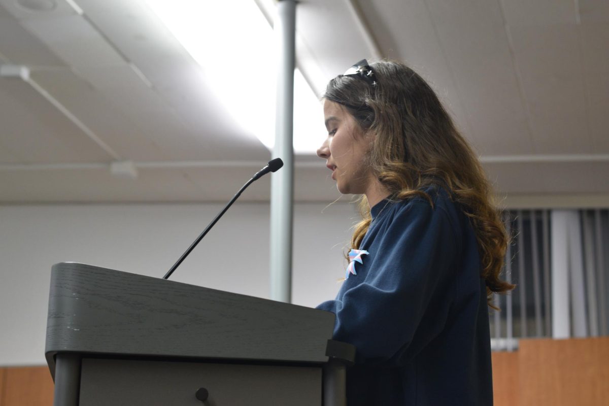 Junior Katya Kuykendall speaks in support of theater teacher Sarah Thermond March 17 at the Palo Alto Unified School District board meeting. According to Kuykendall, Thermond has been a valuable source of stability. “Ms. Thermond is a pillar in Paly Theatre and has given our students the confidence to become internationally recognized performers,” Kuykendall said. “The past two years have been the hardest our community has faced, and Ms. Thermond is our safe adult on campus. … She has anchored us at a time when we are navigating grief, uncertainty, and fear. On behalf of Paly Theatre, we urge you not to further the instability by uprooting our director, teacher and biggest supporter.”
