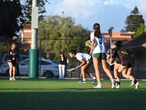 Girls' lacrosse defeats Titans in overtime