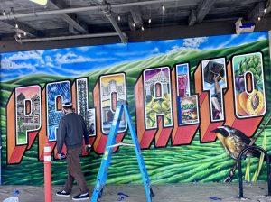 San Francisco-Based muralist Maxfield Bala paints one of two new murals in construction at Town & Country Village. Bala's company, Maxfield Bala Creative, has worked on hundreds of mural designs and painted murals worldwide. "I've been painting murals for the last 12 years now, professionally, but I've been creating art my entire life," Bala said.  "It's really been a lifelong endeavor." 