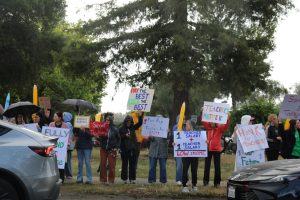 Standing in the rain, Palo Alto Unified School District staff shout out in support of higher teacher salaries amid district negotiations with the Palo Alto Educators Association. Palo Verde Elementary teacher Hannah Hoagland said that the bargaining teams should consider how to look after teachers when working on negotiations. “If they want to continue to have the best education for our students, we also have to think about our teachers and how we can take care of them so that our teachers can take care of our students,” Hoagland said.