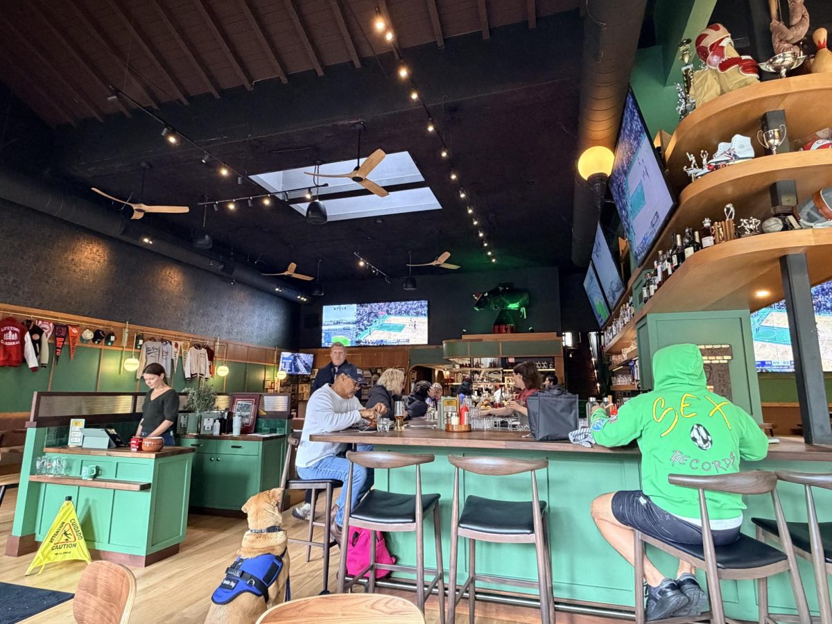 Customers hang out at The Pro, the newly reopened sports bar on Ramona Street. Assistant general manager Sohiel Azim said that The Pro's value lies in its history. "Its history is the amount of people that come in and say, 'wow, I had my birthday at that table,'" Azim said. "I'm a sentimental person. I believe that everything has meaning to it, and it's your responsibility to seek out that feeling. The stuff that's on these walls, they mean something to somebody. Just because it doesn't mean anything to me or you, doesn't mean it's meaningless. And that's the power behind it. Because the people that come [to the Pro] truly have that connection.