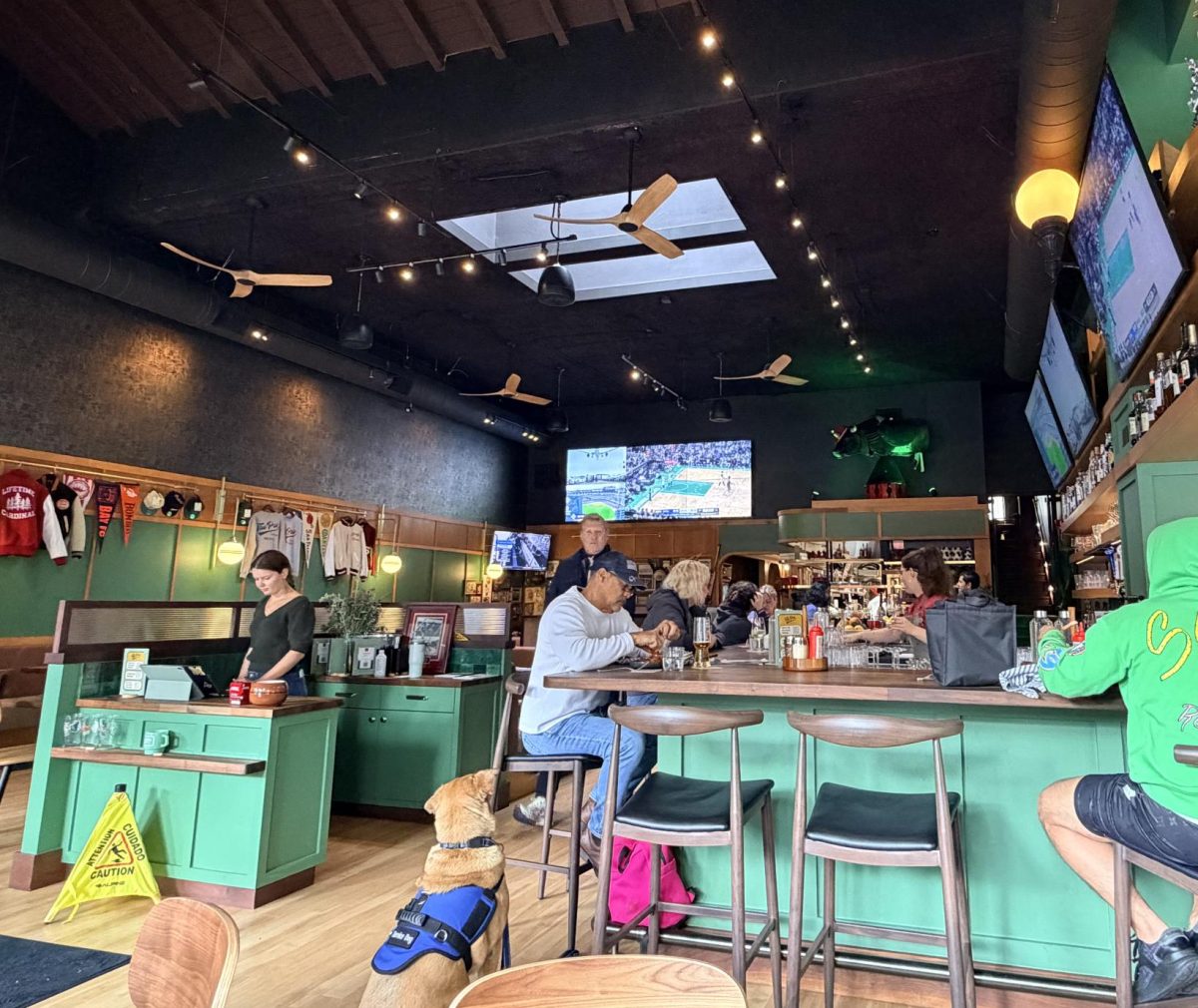 Customers hang out at The Pro, the newly reopened sports bar on Ramona Street. Assistant general manager Sohiel Azim said that The Pro's value lies in its history. "Its history is the amount of people that come in and say, 'wow, I had my birthday at that table,'" Azim said. "I'm a sentimental person. I believe that everything has meaning to it, and it's your responsibility to seek out that feeling. The stuff that's on these walls, they mean something to somebody. Just because it doesn't mean anything to me or you, doesn't mean it's meaningless. And that's the power behind it. Because the people that come [to the Pro] truly have that connection."