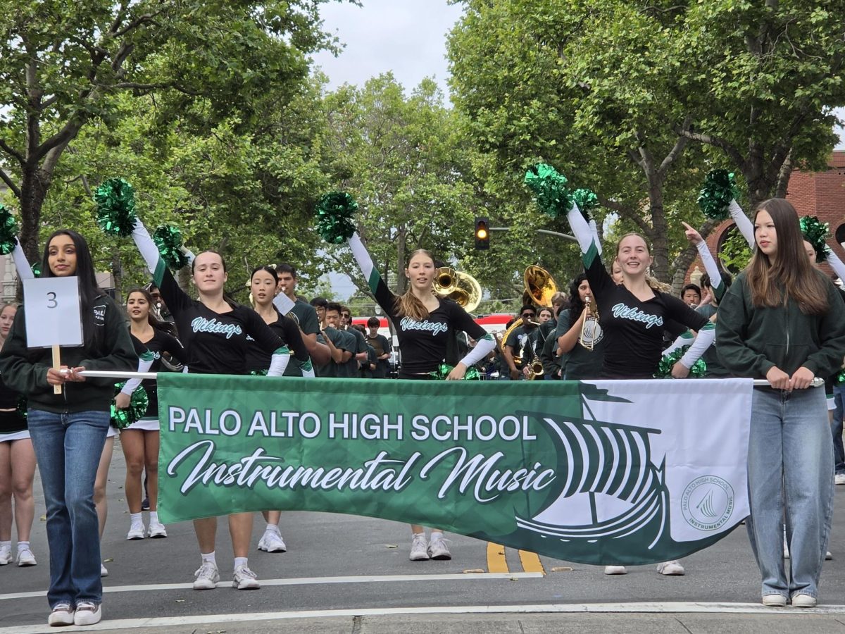 Members of the Paly dance team and band march and perform at the May Fete Parade.