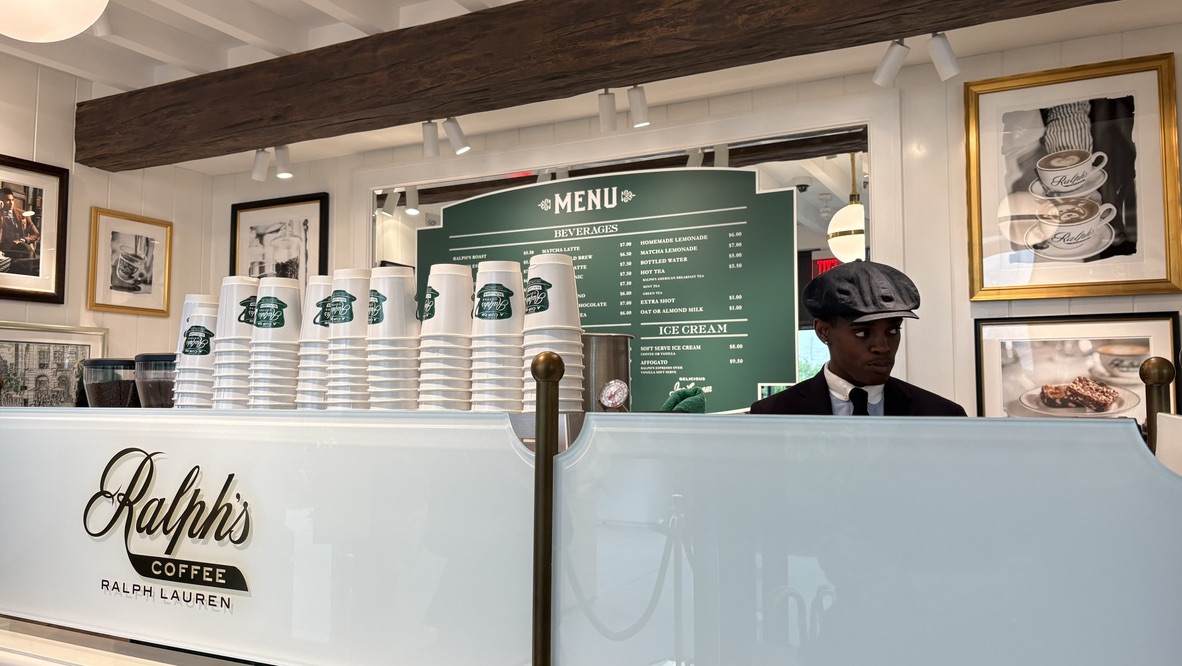 Manager Zanda Robinson prepares drinks at the new Ralph's Coffee, which opened April 16 at the Stanford Shopping Center alongside the Ralph Lauren Store. According to Robinson, the ingredients used are of high quality and standards. "Most of our coffee is from La Colombe. ... They have a very serious rep with their coffee and very serious standards. ... All of the baristas that work here have to learn from a La Colombe representative." 