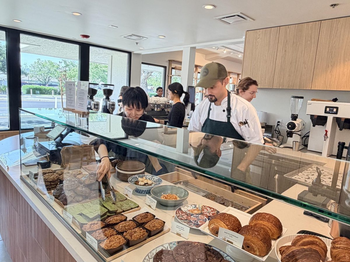 Staff prepare orders at the front counter on May 1 at Yutori, Palo Alto’s newest Japanese-inspired café and market. According to co-owner Lily Peng, the restaurant attracts a wide range of customers from around the neighborhood. “We have families that come with their kids because we have a lot of offerings for children,” Peng said. “There’s also a ton of businesses in the near area.”
