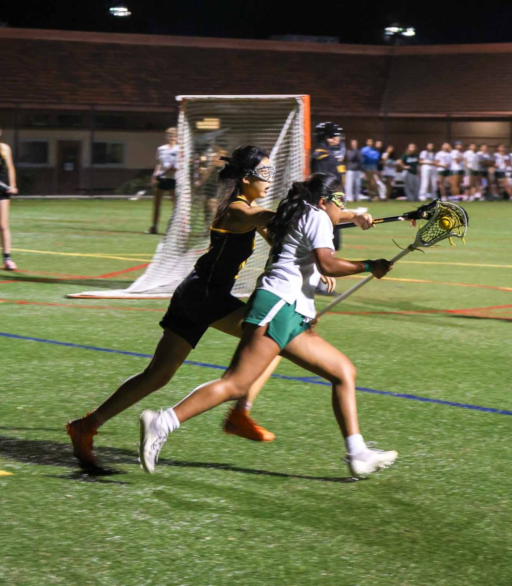 Viking senior Anjini Sanchorawala runs past a Wilcox High School player on March 16 at home. “This was not our best game," Senior Natalie Dymmel said. "We definitely used things from practice from last week after our game on Wednesday, and held them [Gators] to our advantage.”