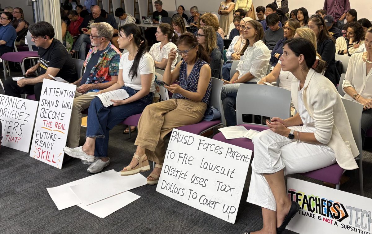 Parents and advocates support Schools Beyond Screens by dressing in white and bringing signs to the Aug. 17 board meeting at the district office. According to Leor Melamedov, educational technology is not functioning as intended. "[Edtech] promised personalized learning, equity, and better outcomes," Melamedov said. "Instead, it lowered attention spans, reduced real learning, and created a constant source of frustration for parents and teachers without delivering the promised results."
