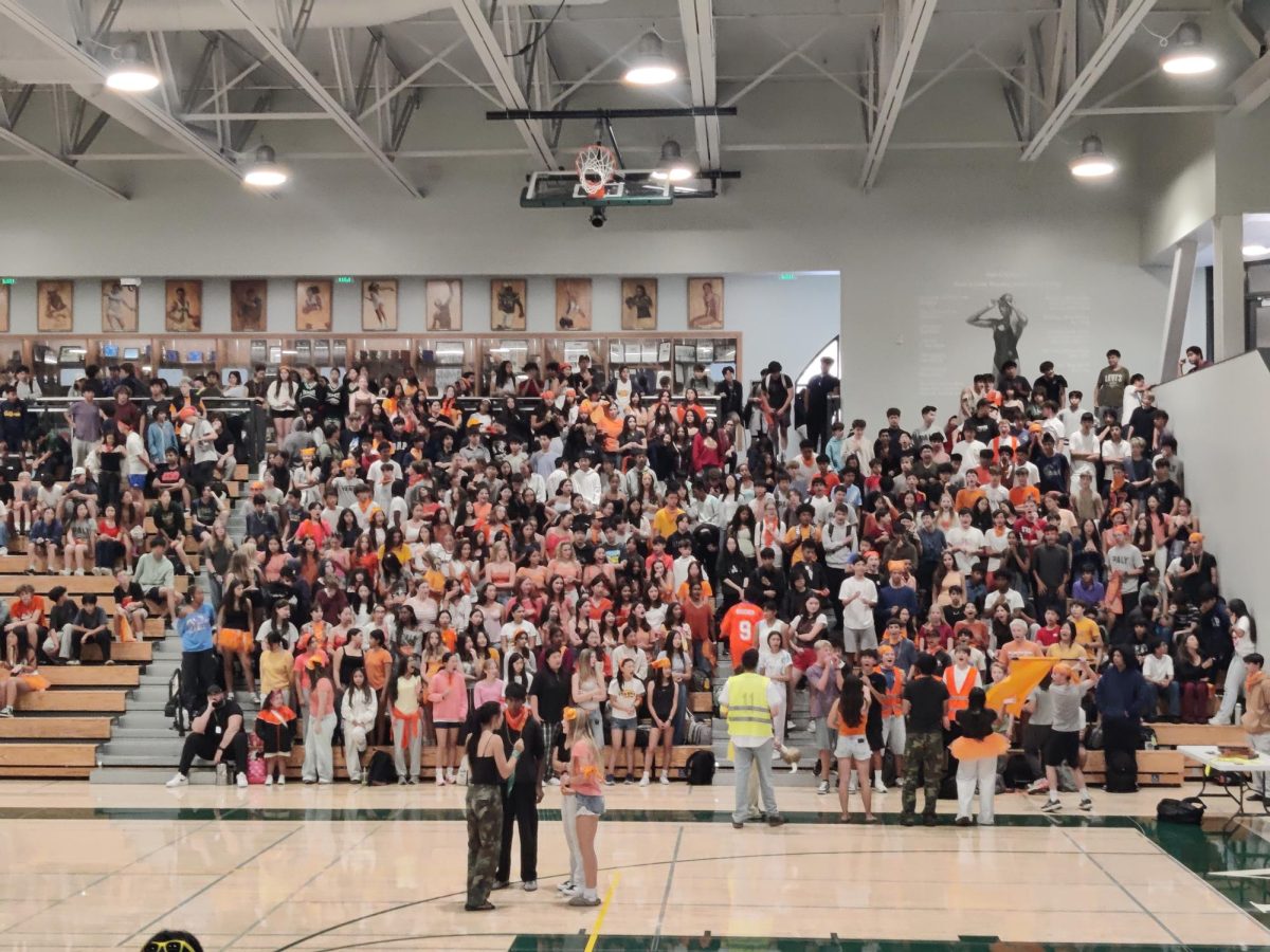 Palo Alto High School freshmen chant “I believe that we will win” while stomping and clapping in beat on Wednesday at the Big Gym for a spirited back-to-school rally. According to Senior Ivanka Kumar, the rally was a great addition for school spirit. “It [the rally] was also a beautiful performance from both the dance team and the cheer teams,” Kumar said. “The cheers really helped bolster the community … not only within a specific grade, but through all of us.”